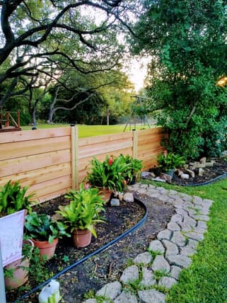 Garden with horizontal wood fence